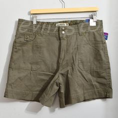 Dakota Blue Women's Short Mid Rise Pockets Flap With Button Soft Stretch Casual Fit Mid Rise Color : Olive Measurement Is For Reference Only Inseam ( In): 5.75 Content : 97% Cotton 3% Spandex Mid-rise Cotton Shorts With Buttons, Mid-rise Cotton Shorts With Button Closure, Casual Khaki Button-up Bottoms, Casual Workwear Shorts With Button Closure, Chino Shorts Women, American Eagle Jean Shorts, Chambray Shorts, Y2k Shorts, Ripped Denim Shorts