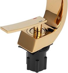 a gold plated object is sitting in a black holder