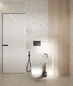 a white toilet sitting next to a shower in a bathroom under a light wood paneled wall