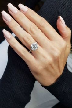 a woman's hand with a ring on it