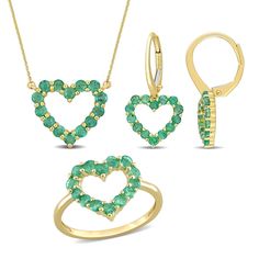 Express your love in the sweetest way when you present this elegant green emerald open heart necklace, ring and drop earrings set. Fashioned in warm 10K gold Each piece features verdant-green emeralds glistening along a simple heart-shaped outline. Emerald is the traditional birthstone for May and symbolizes loyalty, faithfulness and love. The 17.0-inch cable chain necklace secures with a spring-ring clasp. The drop earrings secure with lever backs. The ring cannot be resized after purchase. Heart Cut Emerald Jewelry For May Birthstone, Heart-shaped Emerald Jewelry With Birthstone, Heart-shaped Emerald Birthstone Jewelry, Fine Jewelry Heart Pendant For May Birthstone, Gold Emerald Heart Pendant Jewelry, Heart-shaped Emerald Jewelry For Valentine's Day, Heart-shaped Emerald Jewelry For May Birthstone, Emerald Jewelry For Valentine's Day Gift, Heart-shaped May Birthstone Jewelry As A Gift For Her