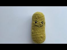 a crocheted toy with a smiley face on it