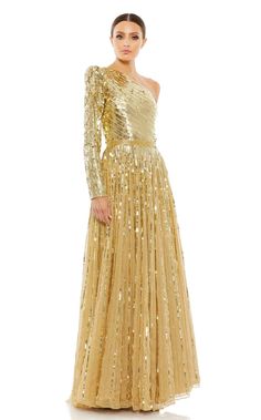 a woman wearing a gold gown with sequins