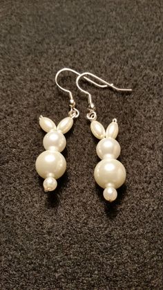 These sweet little bunny rabbit earrings are made out of glass pearl beads. They are perfect for Easter gifts for yourself and your friends or for anyone that just loves bunnies! These would make a unique addition to anyone's jewelry collection and make great gifts for friends and family! Cheap Novelty Beaded Earrings As Gift, Cheap Novelty Beaded Earrings For Gift, Cute Cheap Beaded Earrings For Gifts, Cheap Handmade Earrings For Gifting, Cheap Fun Beaded Earrings For Gifts, Cheap Cute Beaded Earrings For Gifts, Affordable Cute Beaded Earrings For Gifts, Cheap Easter Jewelry Gift, Fun Holidays