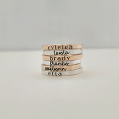 Mother's Day Gift | This personalized stacking ring features a unique and stylish handwriting font or serif font, adding a personal touch to your jewelry collection. Handmade with care, each ring is crafted with fine silver or 14K yellow gold-filled materials for a luxurious look and feel. Make a statement with this modern and customizable piece. Includes one name ring in your choice of font. Everyday Meaningful Hand Stamped Stackable Rings, Personalized Adjustable Rings For Everyday, Mother's Day Adjustable Stackable Rings With Custom Name, Adjustable Stackable Rings With Custom Name For Mother's Day, Personalized Engraved Ring For Everyday, Everyday Adjustable Rings With Name Detail, Adjustable Everyday Rings With Personalized Name, Adjustable Name Rings For Everyday Wear, Personalized Everyday Meaningful Rings