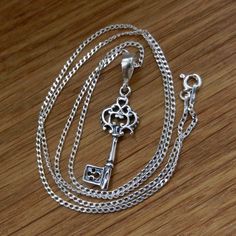 "Sterling Silver necklace with KEY pendant. Curb Chain 1.4mm . Select Length CHAIN. Nickel free. Very good quality, hallmarked 925, made in EU.  Select Length.: - 15.74'' (40cm) - 17.5\" (45cm) - 20'' (50cm) - 21.65'' (55cm) - 24'' (60cm) Clasp: Spring Ring Size: 1.4mm Pendant: 38mm Size key: 30mm x 10mm EARRINGS  for set available here: https://www.etsy.com/listing/784007837/sterling-silver-hoop-earrings-key-elf?ref=shop_home_active_1&frs=1" Key Ornament, Rose Gold Chain Necklace, Crystal Spikes, Romantic Necklace, Key Pendant Necklace, Silver Key, Gold Chain With Pendant, Valentines Necklace, Sterling Silver Hoop Earrings