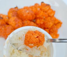 a white bowl filled with rice and meatballs