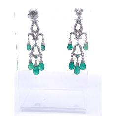 This is part of Chairish’s Fine Jewelry assortment.  These gorgeous Chandelier Earrings are just beautiful.  They are made in 14K white Gold and set with five (5) Emerald Cabochon drops, three (3) small Emeralds are studded within the Diamonds. The length is 5.5 cm or 2 1/2" long.  These earrings pack a punch as they are just stunning.  There are probably approximately 2 carats of Diamonds  throughout.  These earrings are lovely by themselves but I also have a gorgeous pendant that works perfect Elegant Pear-shaped Chandelier Earrings For Formal Occasions, White Gold Teardrop Chandelier Earrings Fine Jewelry, Fine Jewelry Pear-shaped Chandelier Earrings For Formal Events, White Gold Teardrop Chandelier Earrings, Fine Jewelry Diamond Chandelier Earrings, Diamond Chandelier Earrings For Pierced Ears, Elegant Sterling Silver Hand Set Chandelier Earrings, Elegant White Gold Pear-shaped Chandelier Earrings, Elegant Hand Set Pear-shaped Earrings