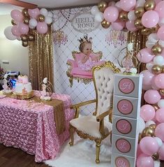 a baby shower party with pink and gold decorations, balloons, and table cloths