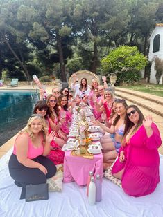 a group of women sitting around a table