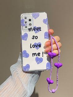 a person holding up a cell phone case that says meet so love me