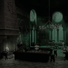 a dark room with tables, couches and chandeliers