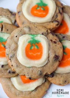 chocolate chip cookies decorated with orange and white frosting