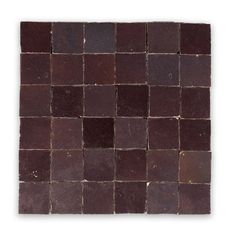 a square tile with brown squares on it