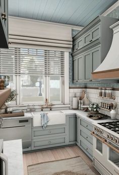 a kitchen with blue cabinets and white counter tops is pictured in this artist's rendering