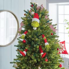 a christmas tree decorated with the grin's face