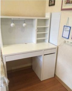 a white desk with shelves and drawers in a room