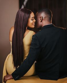 a man and woman sitting next to each other