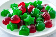 a plate full of green and red gummy bears