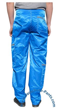 Awesome nylon Panno D’Or Parachute Pants will bring you back to the 80s in no time. You’ll be making a swooshing noise when you walk. These Panno D’Or Parachute Pants have a comfortable fit to release the break dancer in you. The pants come with two zippered pockets on the right leg and one zippered pocket on the left leg, along with two front zippered pants pockets and one zippered back pocket. There are also zippers at the bottom of each leg that optionally creates the 80s ankle tight look. Th Blue Nylon Bottoms With Side Pockets, Blue Full-length Parachute Pants With Side Pockets, Blue Nylon Long Pants, Blue Full-length Nylon Pants, Break Dancer, Back To The 80s, Back To The 80's, Zipper Pants, Body Heat