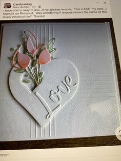 an image of a card with flowers in the shape of a heart and word love