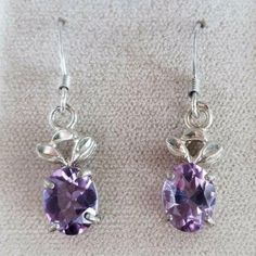 New!! Beautiful Sterling Silver 925 Amethyst Oval Shaped Dangle Earrings With Floral Accent The Perfect Gift! Stone: Natural Purple Amethyst Stone Size: 8.2 X 6.8 Mm Total Item Weight: 3 Grams Be Sure To Add Me To Your Favorites List! Check Out My Other Items! Check Out Our Other Items To Bundle And Save. Want To Make A Bundle, We Are Happy To Combine If You Ask Before Purchase. ~ Fast Shipping With Tracking. We Ship Daily! ~ Secure Payments ~ Long-Time Experienced Seller. ~ We Recycle Boxes Whe Purple Dangle Earrings, Ivory Earrings, Long Drop Earrings, Favorites List, Cz Stud Earrings, Amethyst Purple, Crazy Lace Agate, Amethyst Earrings, Metal Earrings