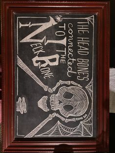 a chalkboard with an image of a skeleton holding a baseball bat