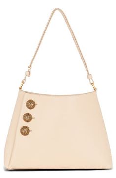 Crest-embellished buttons inspired by the label's ready-to-wear collection detail the sides of this grained leather shoulder bag in a triangular silhouette. Magnetic closure Shoulder strap Interior zip pocket Unlined Leather Made in Italy Designer Handbags Formal Beige Shoulder Bag With Logo Hardware, Elegant Beige Shoulder Bag With Logo Hardware, Beige Leather Shoulder Bag With Logo Hardware, Luxury Beige Shoulder Bag With Logo Hardware, Chic Beige Shoulder Bag With Logo Hardware, Evening Calf Leather Shoulder Bag With Logo Hardware, Shoulder Bag With Turn-lock Closure, Turn-lock Closure Shoulder Bag For Shopping, Luxury Evening Shoulder Bag With Snap Closure