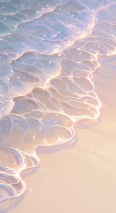 an image of waves coming in from the ocean on a beach with white sand and blue water