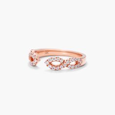 a rose gold ring with diamonds on it