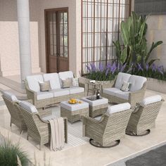 an outdoor living room with wicker furniture