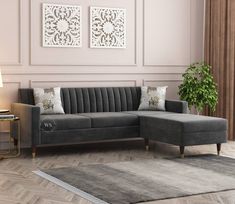 a living room with a gray couch and rug