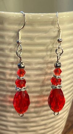 Holiday handmade red sparkling dangle earrings. Red Handmade Dangle Crystal Earrings, Red Handmade Crystal Dangle Earrings, Handmade Red Crystal Dangle Earrings, Handmade Red Crystal Drop Earrings, Red Teardrop Chandelier Earrings As Gift, Red Handmade Drop Earrings, Handmade Red Crystal Earrings For Gift, Red Drop Crystal Earrings As Gift, Elegant Handmade Red Crystal Earrings