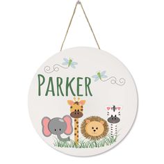 a white sign with animals on it that says parker and is hanging from a rope