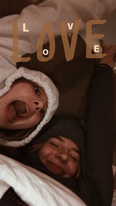 two people laying in bed with the words love above them and an image of their faces