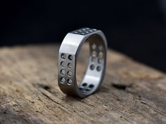 Put this on your finger and you'll never want to take it off! The technically challenging machined design is super comfortable on your finger because of the ultra low profile square shape, and you're sure to stand out since the style is unlike anything else out there! Titanium is hypoallergenic and can even be worn by people with severe metal allergies! Typically ships within weeks, not months like some! Every Richter Scale ring is covered by our 100% Guarantee --About the Ring-- About This Ring Richter Scale, Mens Wedding Rings Titanium, Mens Rings, Titanium Wedding Band, Men's Wedding Ring, Big Rings, Diy Rings, Detailed Ring, Wide Rings