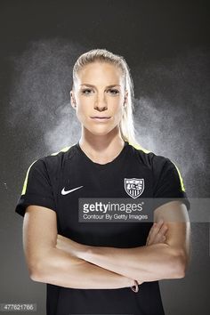 a female soccer player poses for a portrait