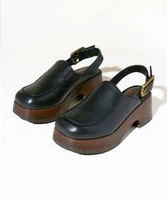 Clogs With Backs, Chic Clogs With Ankle Strap And Buckle Closure, Chic Ankle Strap Clogs With Buckle Closure, Leather Slingback Clogs With Heel Loop, Chic Clogs With Wooden Low Heel, Leather Clogs With Wooden Heel And Square Toe, Casual Low Heel Mules With Buckle, Casual Low Heel Mules With Buckle Closure, Retro Leather Platform Mules