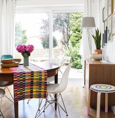 the dining room table is decorated with bright colors