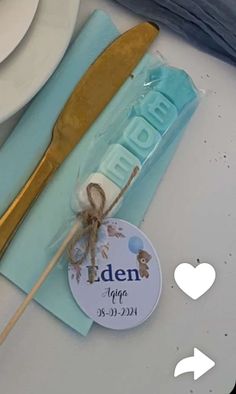 a close up of a plate with a fork and spoon on it, next to a sign that says iden