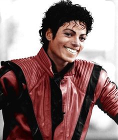 a man with black hair wearing a red leather jacket