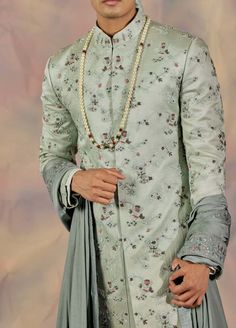 Editor's Note Featuring Heavy Hand Embroidered Sherwani With A Hint Of Pink Details And Dabka And Gold Highlighting. Paired With Chateau Grey Embroidered Stole, Hazy Blue Safa And Tone On Tone Pintuck Detailed Kurta And Churidar. Fabric: Linen Silk Color: Green Component: Sherwani, Kurta, Churidar, Safa, Stole Care: Dry Clean Only About the Designer After establishing himself as the leading couturier in the industry of menswear, Jatin Malik went on to explore luxury footwear. You can order onlin Manpreet Toor, Jatin Malik, Embroidered Sherwani, Dhoti Pants, Luxury Footwear, Pink Details, Royal Look, Haldi Ceremony, Indian Man