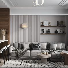 a living room filled with furniture next to a wall covered in bookshelves and shelves