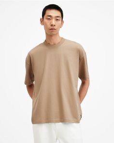 Take it easy in the Jase T-Shirt. This oversized style has been made from organic cotton with a crew neck and short sleeves. Complete with our distinctive stitchwork and ribbed neck band. The earthy-toned finish has been achieved by using a conscious mud dye.  This t-shirt is designed to be worn oversized If you are between sizes or prefer a closer fit, we recommend sizing down Short sleeve Pullover Ribbed neckband Single needle stitch on the arm Scar stitching on the hem and cuffs AllSaints bra Going Out Outfits Men, Oversized Style, Take It Easy, Short Sleeve Pullover, Knitwear Men, Going Out Outfits, Sweaters And Jeans, All Saints, Jean Shirts