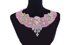 "This is a beautiful statement piece that will add a feminine and romantic look to any outfit.  Designed in all pastel colors.  The pink collar portion has great dimension to it.   The collar portion has been embellished with several hand dyed lace appliques.  The center applique is of 5 dangling flowers in green and pink.   In the very center sits a re-purposed metal dress clip that we redesigned with many different clay pastel colored flowers.  The flowers are in several different sizes so the Dangling Flowers, 1950s Earrings, Metal Dress, Fabric Necklace, Colored Fabric, Colored Flowers, Dress Clip, Pink Collar, Pink Collars