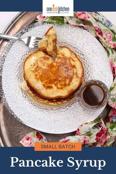 pancake syrup on a plate with a fork and spoon in front of it that says, small batch