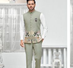 This is a Classic Jacket by Groom wear studio crafted from high quality fabric and imported materials. Our products are handcrafted by experienced tailors who make sure the that the stitching is precise, lining is proper and the overall product is sturdy enough to not go out of shape for more than a few years. Also all our products have extra margins in their length, sleeves, sides so it's easily alterable if your size changes after some time. To see more available colours and designs in this co Green Floral Embroidered Nehru Jacket For Eid, Green Floral Embroidered Nehru Jacket For Wedding, Transitional Green Nehru Jacket With Floral Embroidery, Wedding Green Bandhgala With Floral Embroidery, Green Floral Embroidered Sherwani For Wedding, Wedding Sets With Floral Embroidery And Stand Collar, Embroidered Green Nehru Jacket For Wedding, Wedding Nehru Jacket With Motifs And Long Sleeves, Traditional Embroidered Groom's Suit