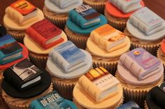 cupcakes with books on them sitting on top of each other