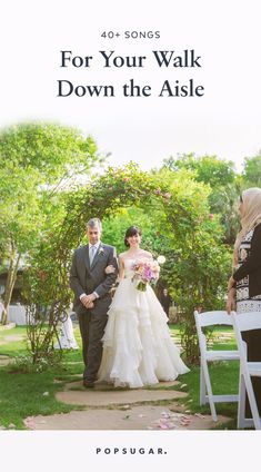 a man and woman are walking down the aisle