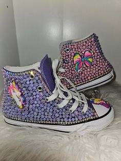 Solid color shoes  1 shoe w/purple pearls 1nd shoe w/ pink pearls Unicorn theme with Jojo Charms added You can choose a different theme as well as colors Purple Round Toe Party Sneakers, Cute Purple Round Toe Sneakers, Beaded Shoes, Unicorn Theme, Purple Pearl, Pink Pearl, Athletic Shoes, Charms, Bathing Beauties